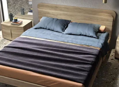 Letto in essenza legno con testiera Glow di Mab